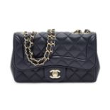 Chanel: a small Classic Flap navy blue lambskin shoulder bag, the quilted leather with curved