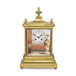 An Aesthetic movement brass and porcelain clock retailed by Maple & Co, late 19th/early 20th