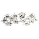 A set of six Herend porcelain custard cups and covers, 20th century, with stands, the lids applied