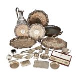A collection of small silver items, pin dishes, cruets and cigarette cases, together with a