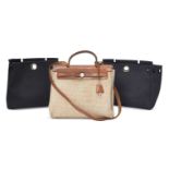 Hermes: an Hermes tan leather and fabric Her bag, together with two outer covers, one navy blue