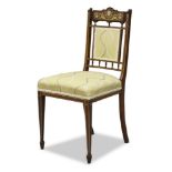 An Edwardian rosewood and ivory inlaid side chair, the shaped crest rail with urn and scrolling