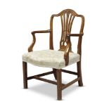 A George II mahogany armchair, the serpentine top rail, above pierced and waisted splats, with