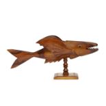 A Pitcairn Island carved wood model of a flying fish, 20th century, inscribed FROM PITCAIRN ISLAND /