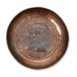 WITHDRAWN A miniature copper alms dish, probably English, 17th/18th century, decorated to the centre