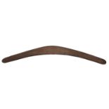 An Australian hardwood boomerang, early 20th century, overall carved with geometric line decoration,