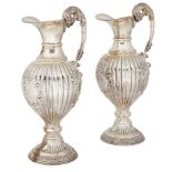 A pair of modern Spanish silver wine ewers, with lobed body and vacant cartouches, 33.5cm high, 43.