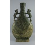 A Chinese green hardstone bottle vase, of recent manufacture, with two kylin handles, decorated with