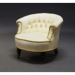 A Victorian button back tub chair, upholstered in cream fabric, with rope twist trim, raised on