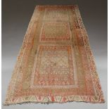 A large Afghan Kelim carpet, mid-20th century, decorated with three square geometric panels on a