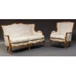 A Louis XV style walnut sofa suite, early to mid 20th Century, comprising a pair of two seater sofas