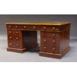 A late Victorian mahogany pedestal desk, the rectangular top inset with green leather writing