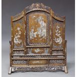 A Chinese hardwood and mother of pearl inlaid fire screen, early to mid 20th Century, with overall