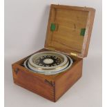 A painted metal maritime compass, mid 20th century, on a metal gimbal, in a wooden box, the