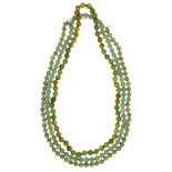 Three jade/jadeite bead necklaces, 20th century, all in tones of green, one with variegated green/