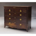A Regency mahogany chest of drawers, the rectangular top above shallow frieze drawer and two short