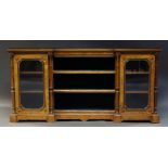 A Victorian burr walnut an ebonised credenza, the the inverted breakfront top above shelves with
