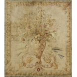A petit point needle work panel, 19th century, of a Neoclassical form vase flanked by two birds