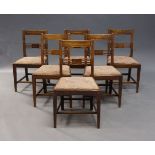 A set of six Edwardian mahogany dining chairs, with bar back rail, above slatted back rest, with