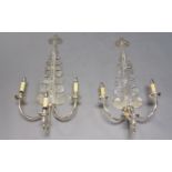 A pair of silvered metal three branch wall lights, late 20th century, with scrolling branches