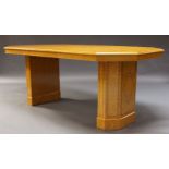 A modern burr wood, crossbanded and inlaid dining table, the canted rectangular top on two hexagonal