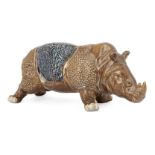 A Japanese studio pottery model of a rhinoceros, early 20th century, standing four square, glazed in