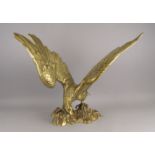 A large brass model of an eagle, 20th century, shown spreading its wings, 50cm highPlease refer to