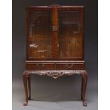 A mahogany and glazed display cabinet, in the Queen Anne taste, late 20th Century, the top