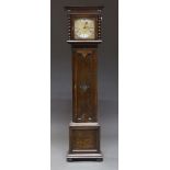 An Edwardian oak grandmother clock, early 20th century, with plain case, the brass dial with