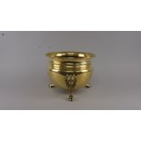 An Edwardian polished brass planter, early 20th century, the neck with ring form decoration above