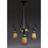 A wrought iron three light chandelier, , the frame with gilt leaf decoration, mid/late 20th century,