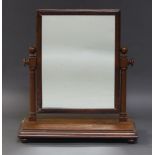A Victorian mahogany swing frame dressing table mirror, the rectangular plate, on turned supports,