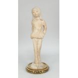 A terracotta sculpture of a Chinese woman, modelled standing on a naturalistically modelled base,