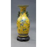A large Chinese porcelain vase, 20th century, incised with temple lions and cubs amidst trailing