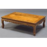 A Chinese rosewood low table, late 19th, early 20th Century, the rectangular top above shaped frieze