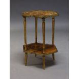 A French hexagonal two tier occasional table, with applied lacquered and painted decoration of