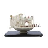 A Chinese Canton ivory model of a pleasure boat, 19th century, of two levels, intricately carved