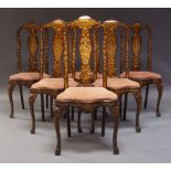 A set of six Dutch floral marquetry inlaid dining chairs, late 19th Century, the solid splats inlaid