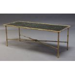 A brass bamboo form coffee table, c.1960, the rectangular mottled mirror top, on bamboo form