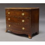 A Regency mahogany bow front chest of drawers, with brushing slide above three long graduated