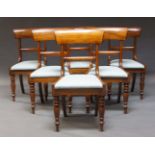 A set of six early Victorian mahogany bar back dining chairs, with deep curved top rails, above pale