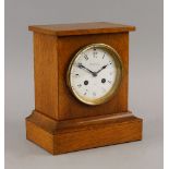 A late Victorian oak cased mantel clock by Charles Frodsham and Co., the case of plain design, the