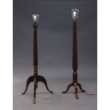 A mahogany standard lamp, early 20th Century, on reeded and turned column to curved tripod legs to