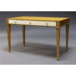 A modern oak desk, of recent manufacture, the rectangular top above three vellum drawers, raised