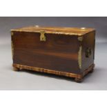 A teak and brass mounted trunk, late 20th Century, the hinged rectangular top with scalloped edge,