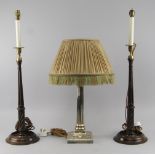 A pair of George III mahogany candle sticks, with brass candle cups, converted to table lamps,