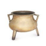 A North European bronze cauldron,17th/18th century, with angular side handles and three facetted