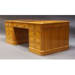A modern burr wood, crossbanded and inlaid pedestal desk, late 20th Century, the breakfront top,