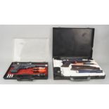 A Topper Secret Sam Suitcase Gun and Camera, the black plastic attaché case with rifle, silencer,