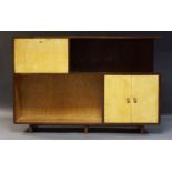 A French mahogany and parchment side cabinet, c. 1940/50, the top section with fall front, enclosing